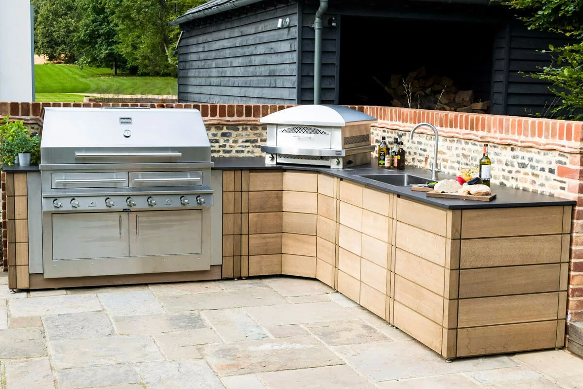 Outdoor kitchen with pizza oven and grill